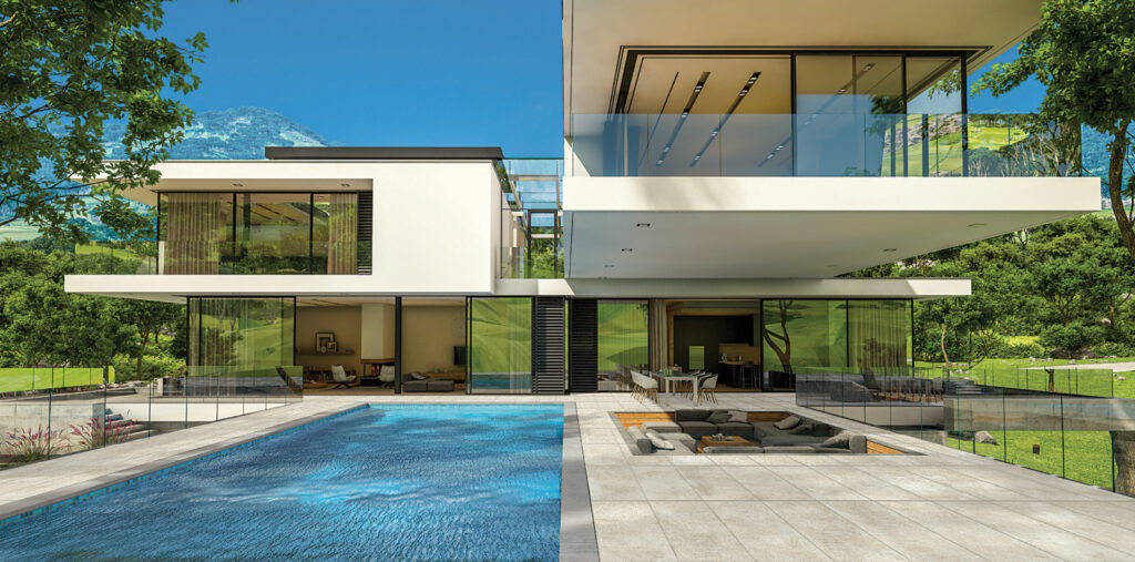 Espace extérieur d'une villa avec piscine, revêtu de grès cérame effet pierre.