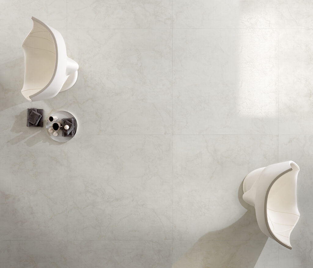 Porcelain stoneware tile with a white marble effect and pronounced veining.