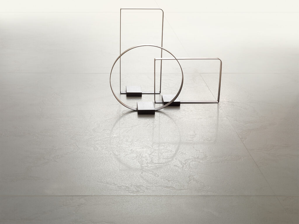 Compact-body porcelain tile with white marble effect.