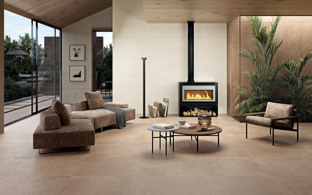 living con arredo marrone, caminetto, pavimento e rivestimento in gres