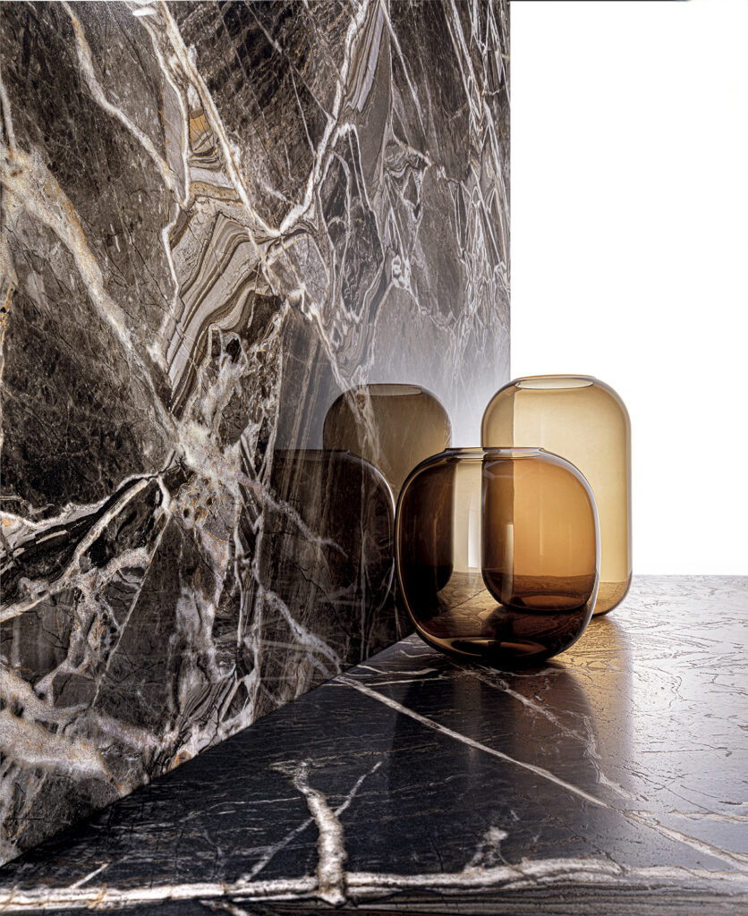 Porcelain stoneware floors and walls with black marble effect, crystalline veining, and glossy or soft finish